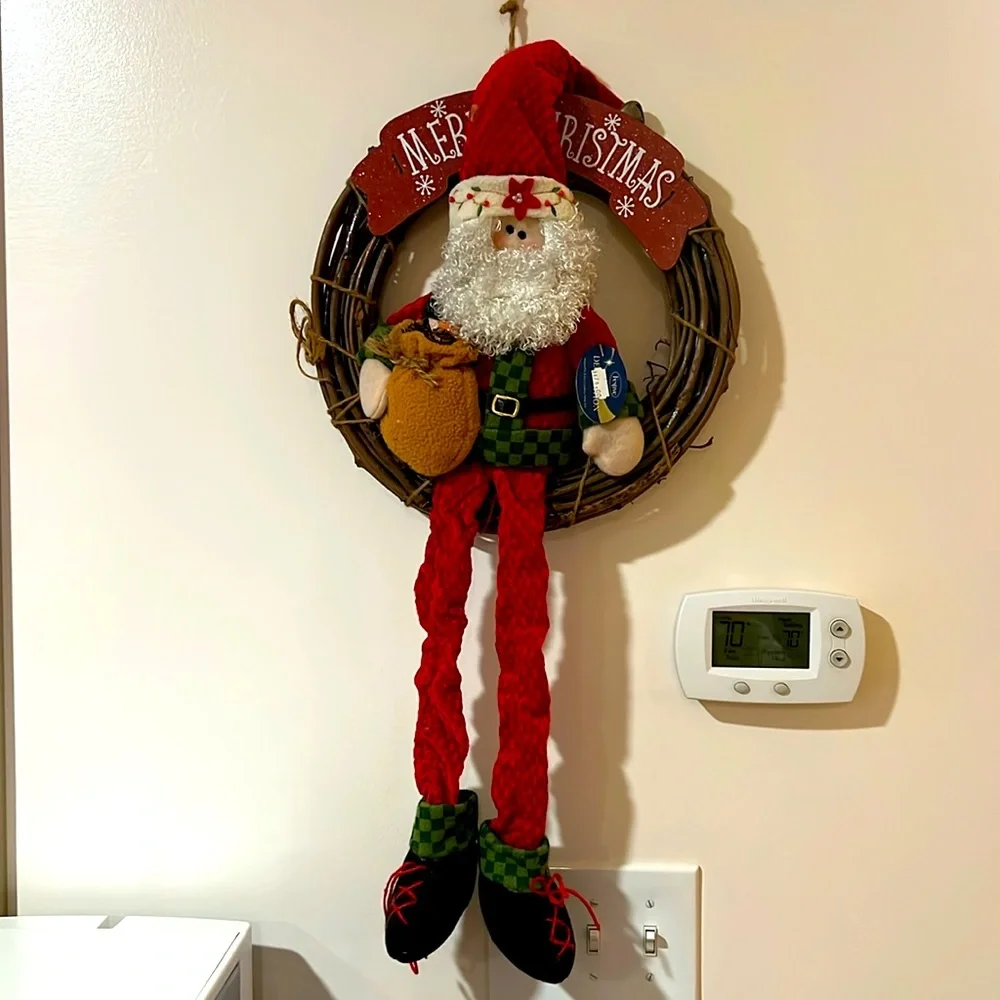 Festive. Merry Christmas. Sitting Santa Claus on the Wooden Bench.
